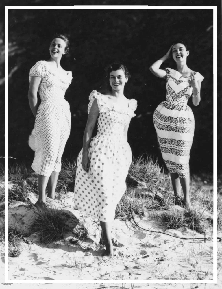 StateLibQld_1_198347_Models_wearing_billowy_dresses_on_the_beach_at_Surfers_Paradise,_1951.jpg