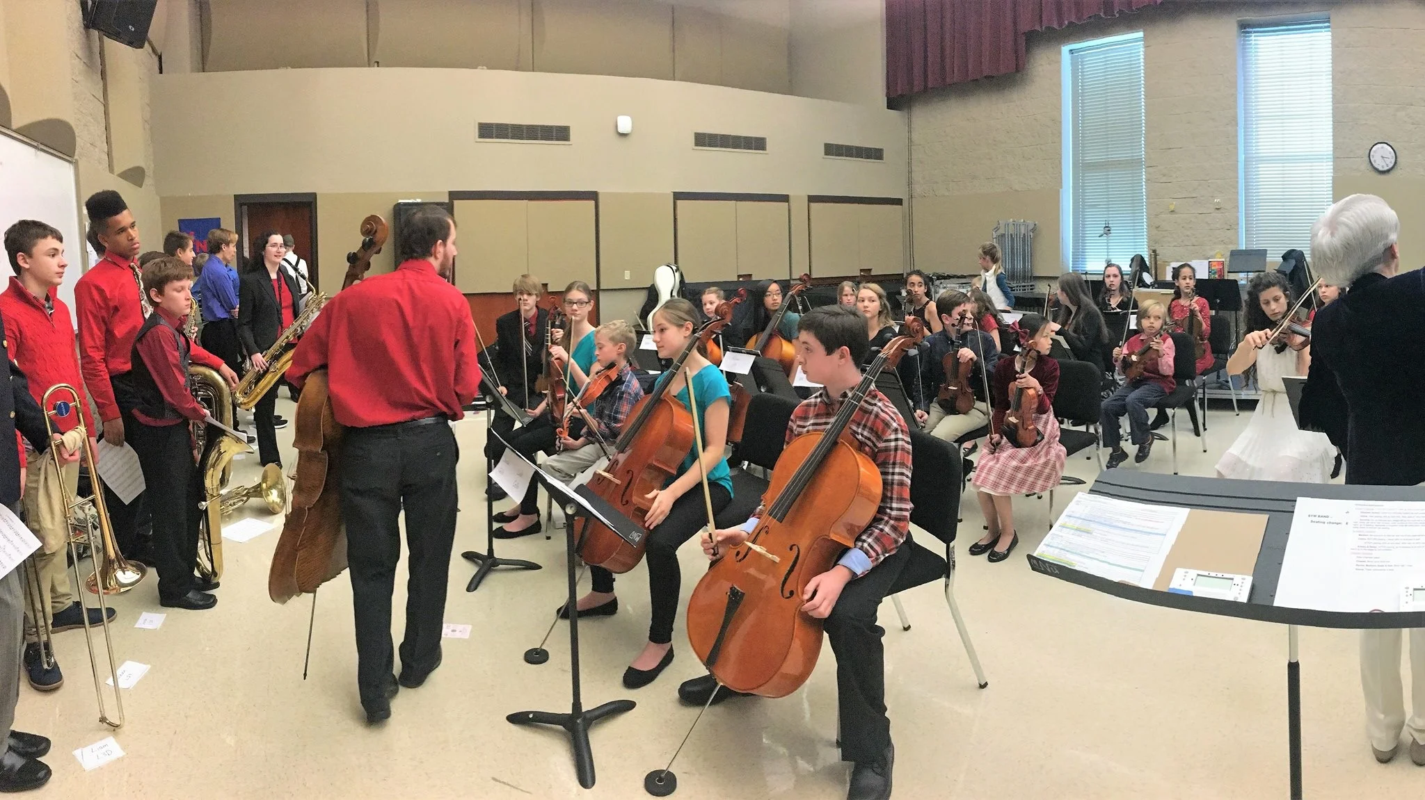 In this slightly distorted image, Matthew is backstage helping the REW Homeschool Orchestra get ready for their concert in December 2017.