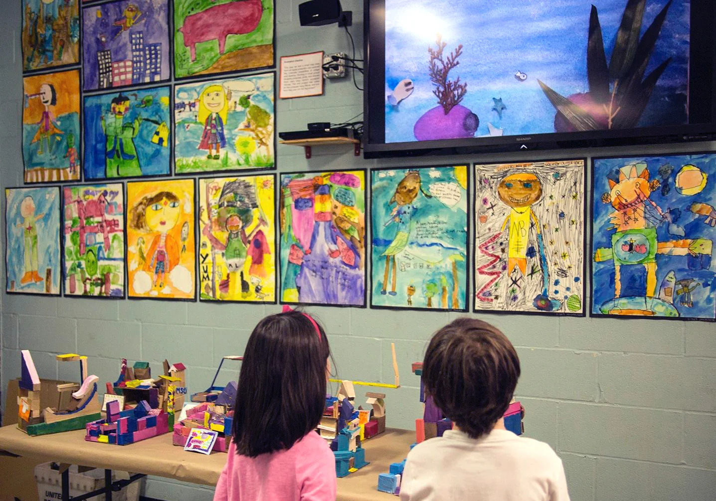 Third grade superhero painting project.