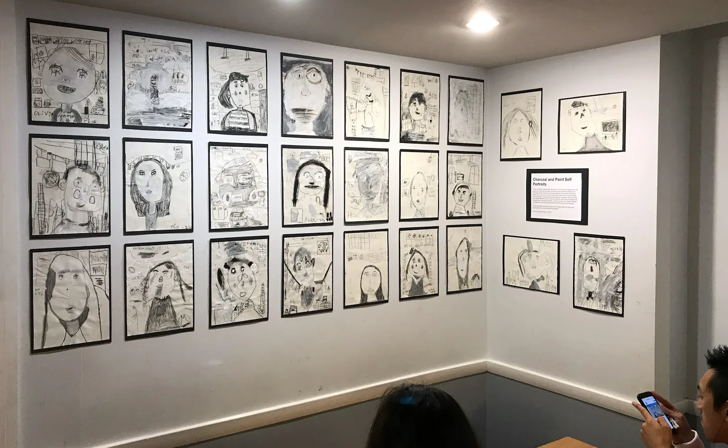 First grade self portraits on display at a neighborhood cafe.