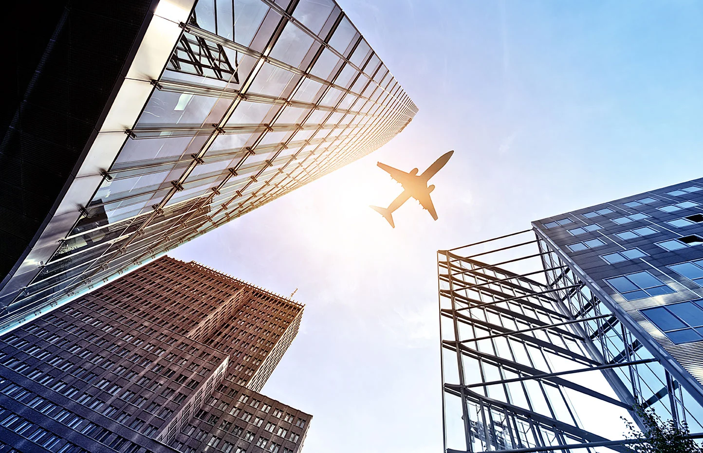 shutterstock_223532947---buildings-with-plane(small).jpg