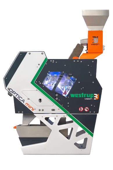 Eine Maschine mit der Bezeichnung „Optica Mini“ und den Markenzeichen WestRup und „Optica Mini“, die für die optische Prüfung oder Fertigung eingesetzt wird und über einen Trichter an der Oberseite für die Materialzufuhr sowie ein digitales Display oder Bedienfeld verfügt.