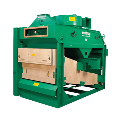 Grüne Industriemaschinen mit Bedienfeldern und Holzelementen, mit der AufschriftWestrup“.