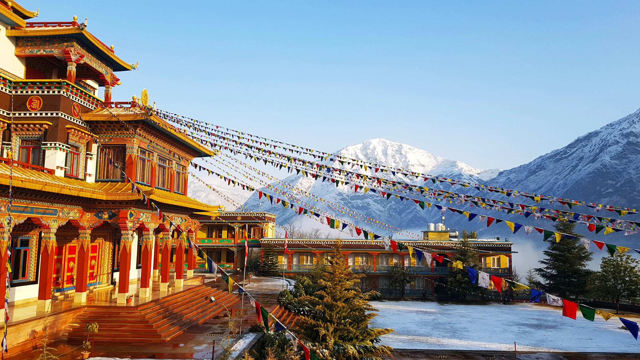 Dechen Choekhor and the snow-capped Chakrasamvara Holy Mountain