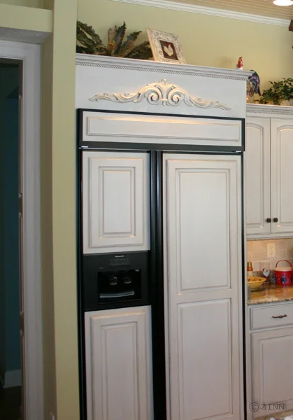 Paint and glazed refrigerator panels with carved onlay