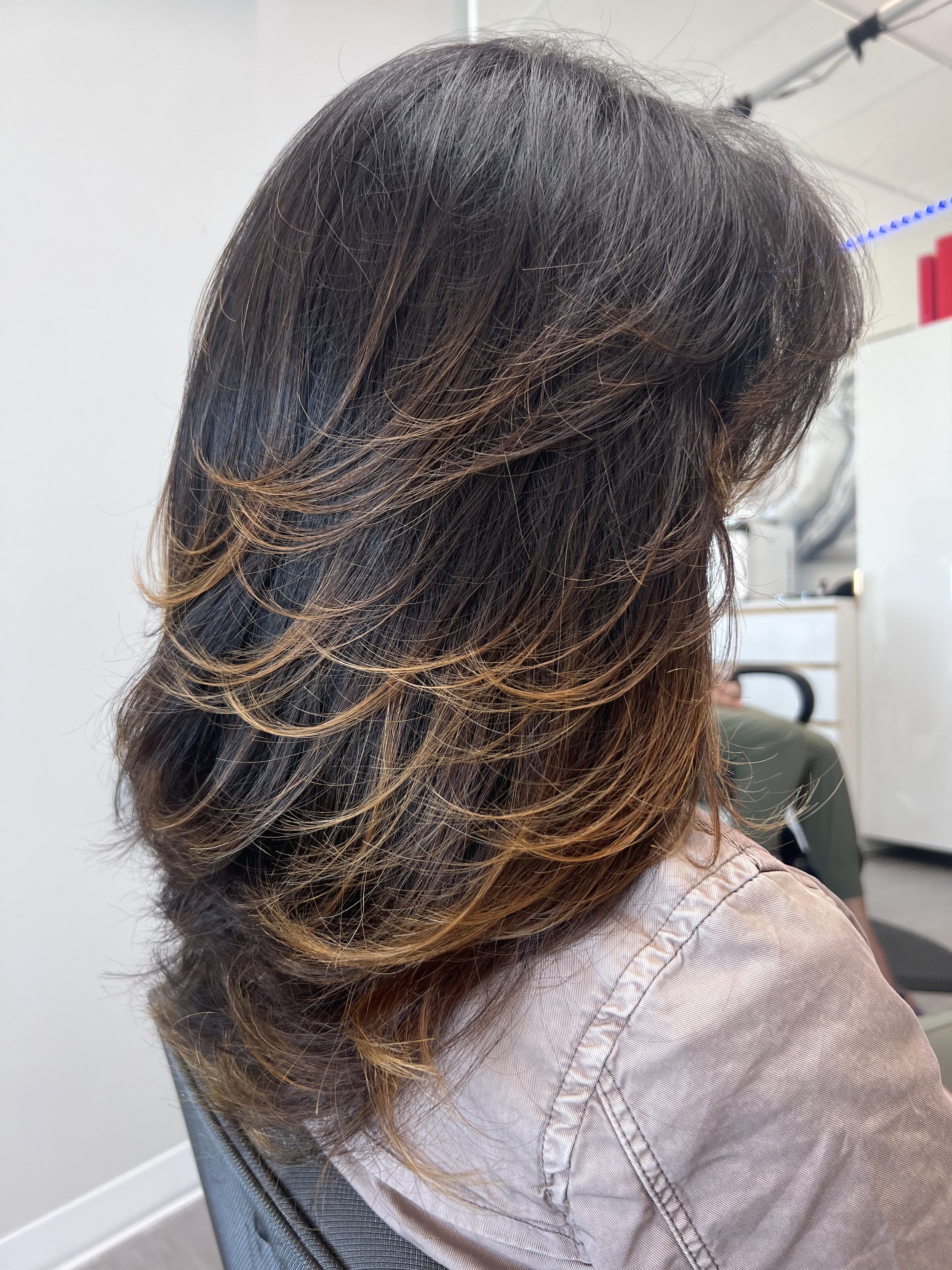Precision layered haircut with soft movement and brunette hair color for grey coverage with dimensional dark blonde highlights for women in Nichols Hills Oklahoma City