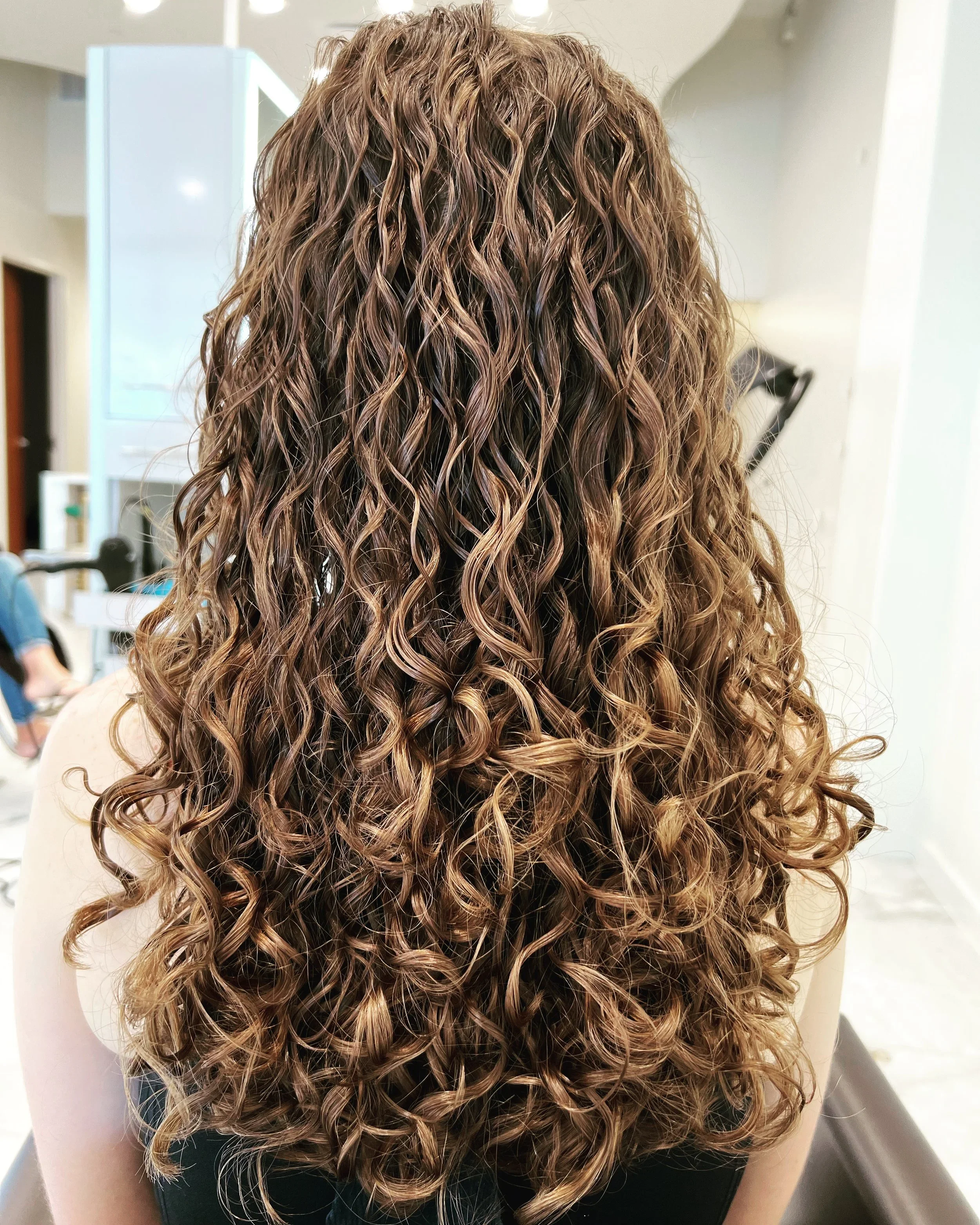 Curly-Haircut-Scott-Risk-Velvet-Cascade-Curls.webp