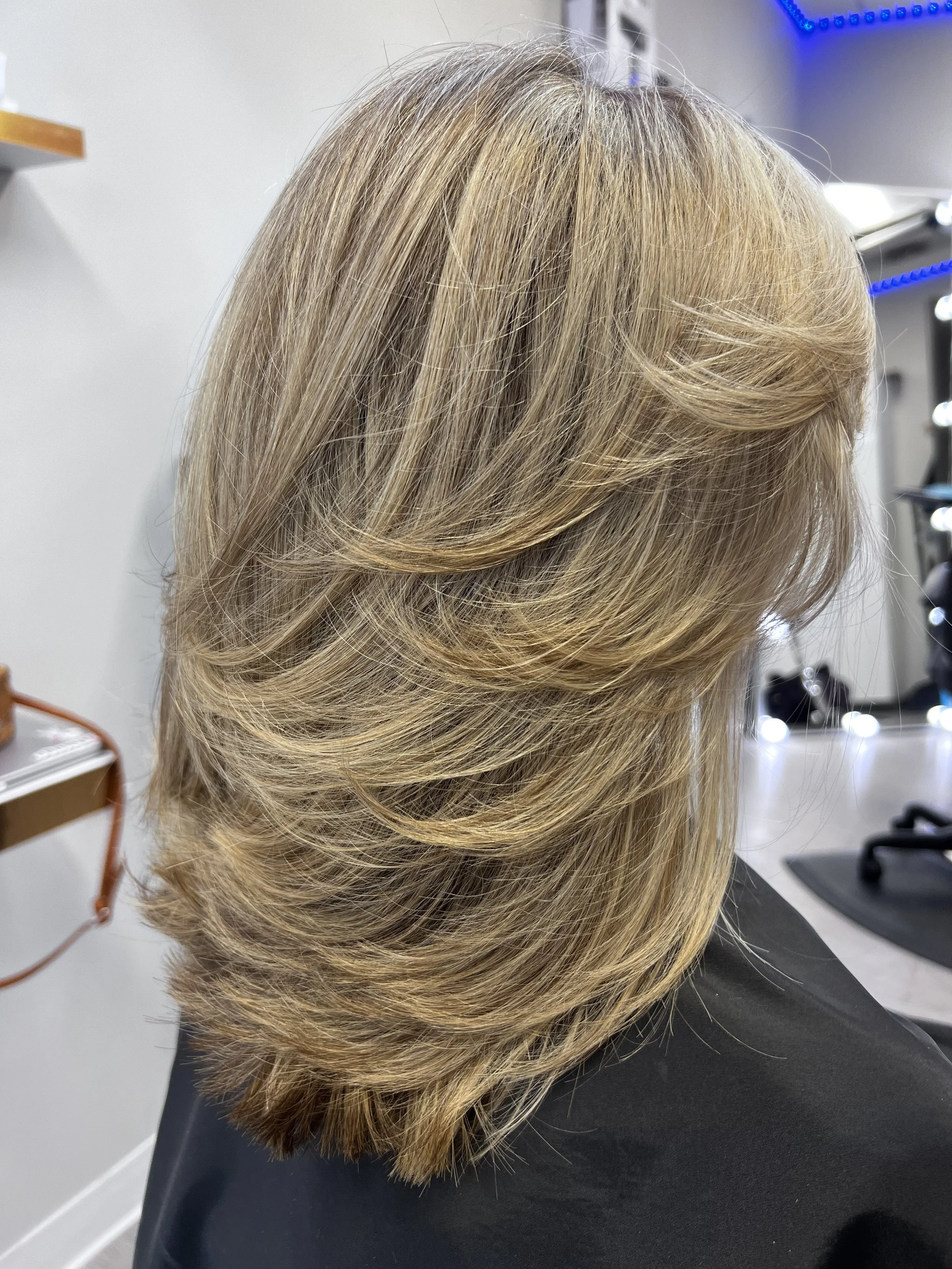 Blonde layers with soft movement for fine hair in Nichols Hills Oklahoma