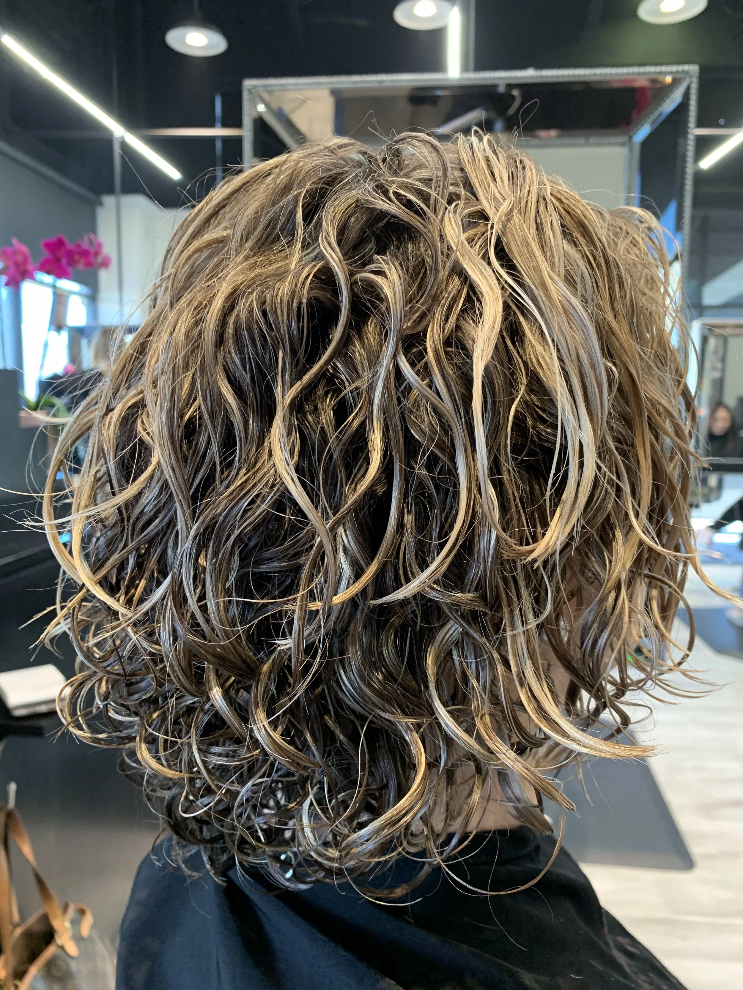 Curly layers in Frisco TX for lift, shape, and natural curl movement
