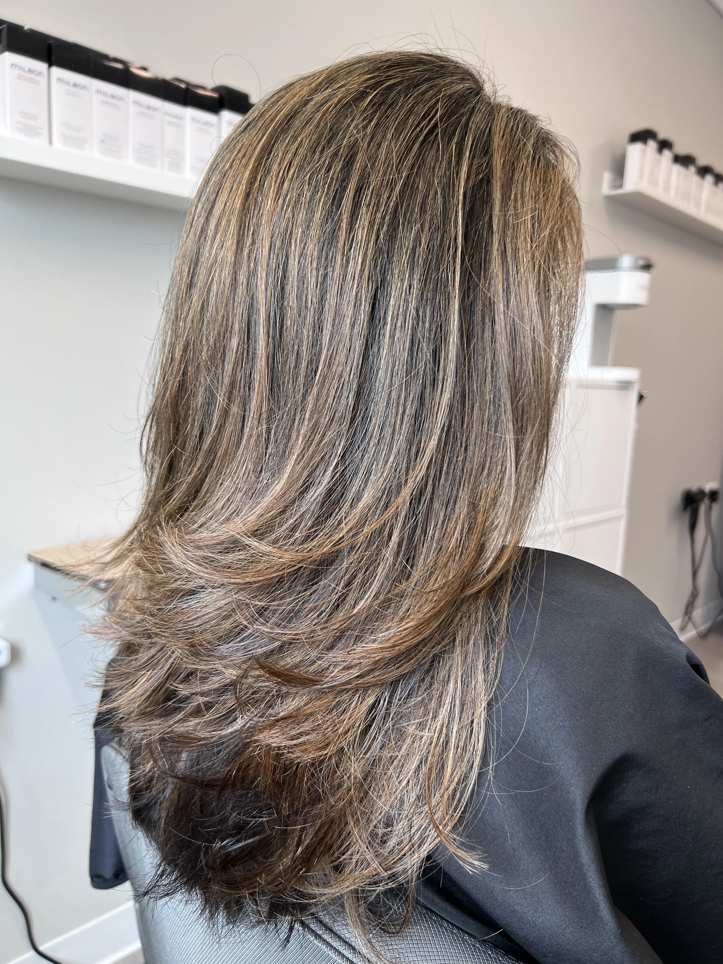 Dimensional brunette layered haircut with clean perimeter and balanced weight distribution