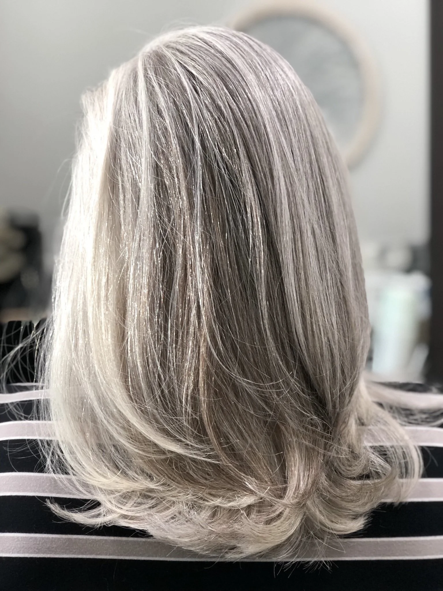 Natural gray long layered haircut with soft movement by Scott Risk in Nichols Hills Oklahoma
