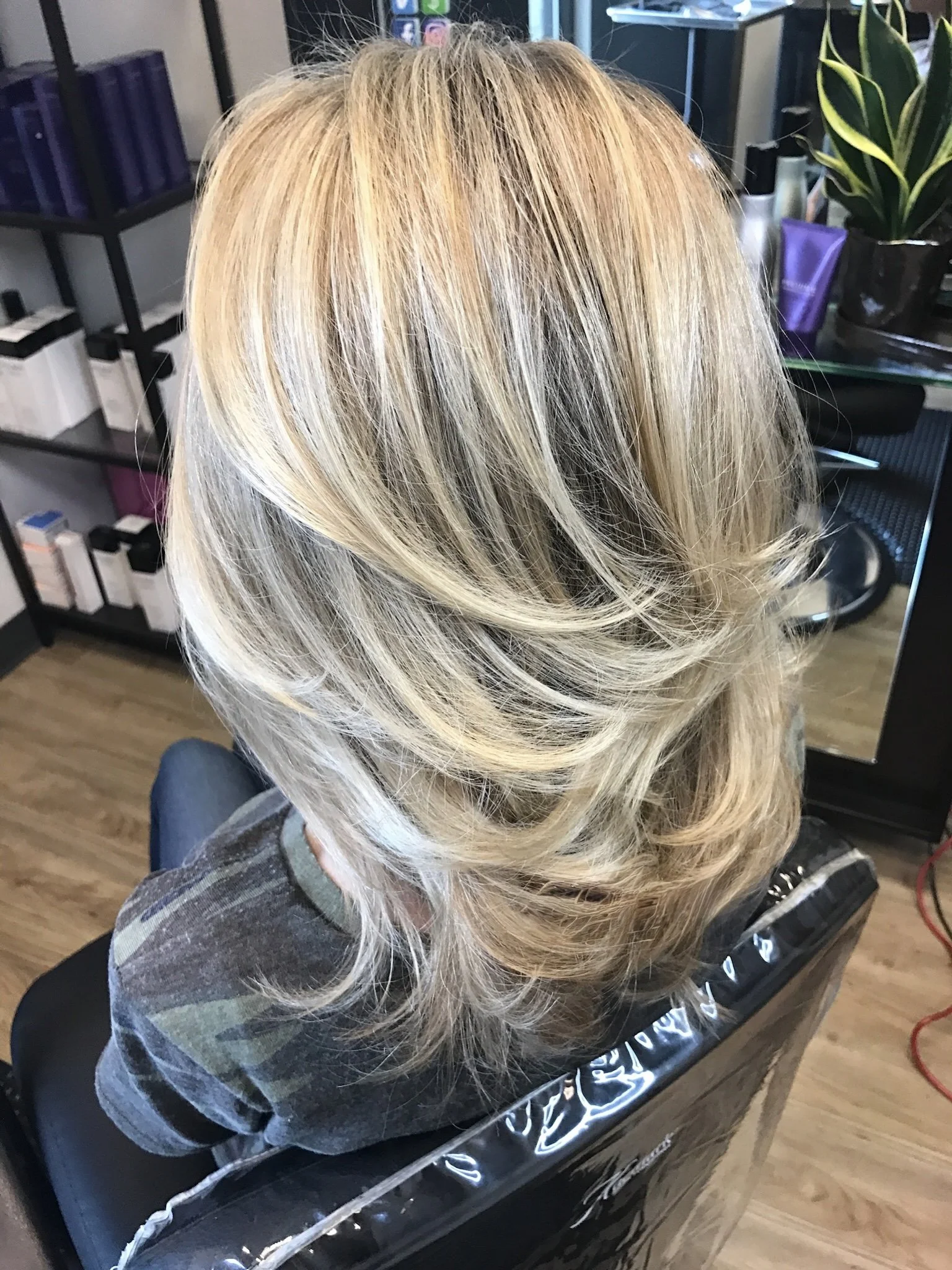 Dimensional blonde highlights with seamless layered haircut in Nichols Hills Oklahoma