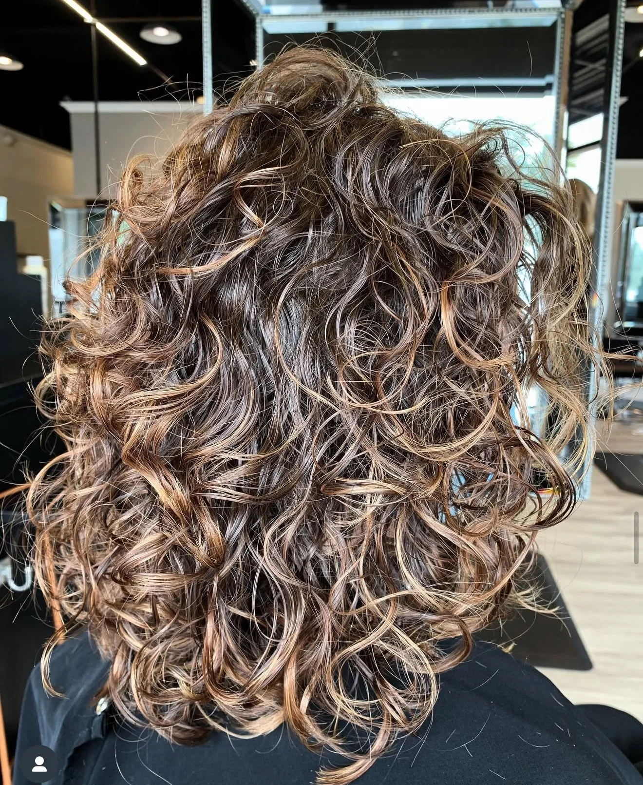 Precision layered wavy haircut for fine to medium hair with controlled movement, balanced shape, and soft natural texture without bulk — Frisco and Southlake Texas