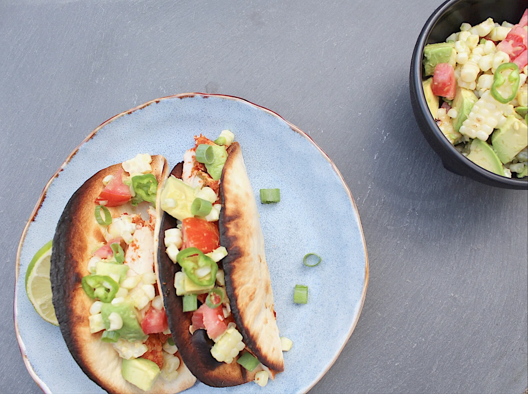 Grilled Chicken Tacos filled with Corn and Avocado Salsa
