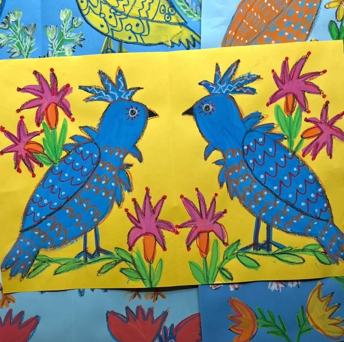 Birds and flowers in a folk art style&mdash;it&rsquo;s always a little magical for children to see the mirror image of their drawing appear! A simple way to learn about symmetry&mdash;learning by doing. Inspired by Ukrainian artist Maria Prymachenko&