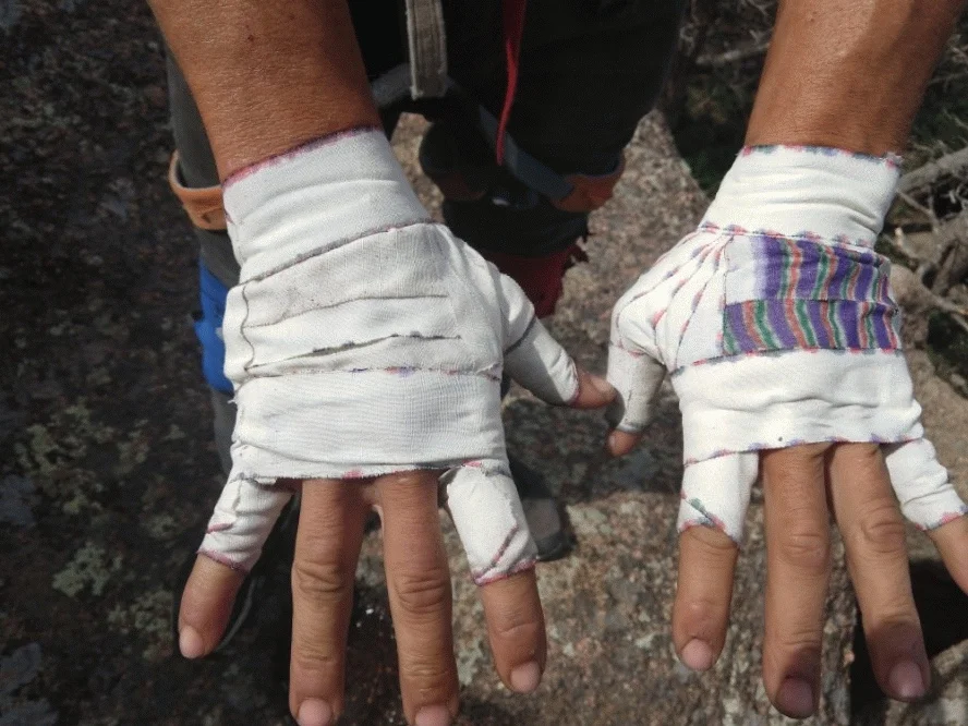 The fully prepared hands of a professional athlete, Devin Fin in Vedauwoo, WY.