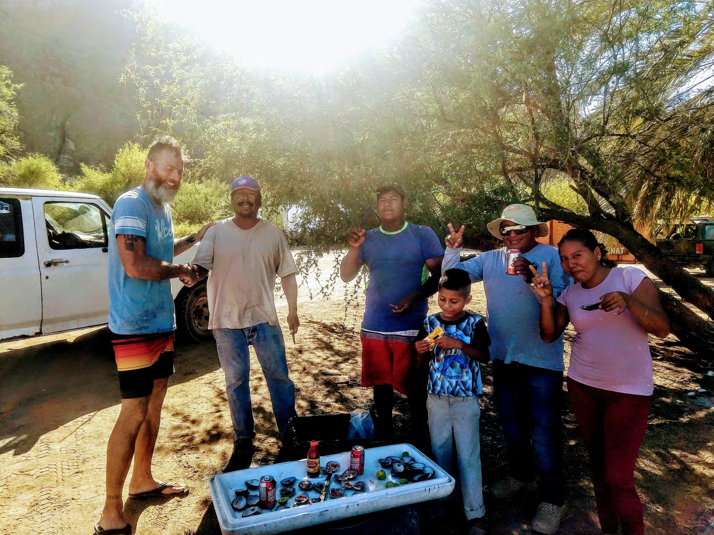 Bahia Conception - Danielle, Victor, & others… Sampling the chocolate clams. I ate over a dozen of these every day for three days…delicious with lime and hot sauce. Tiffany even ate a few of them…Pelé tried one and spit it out immediately.