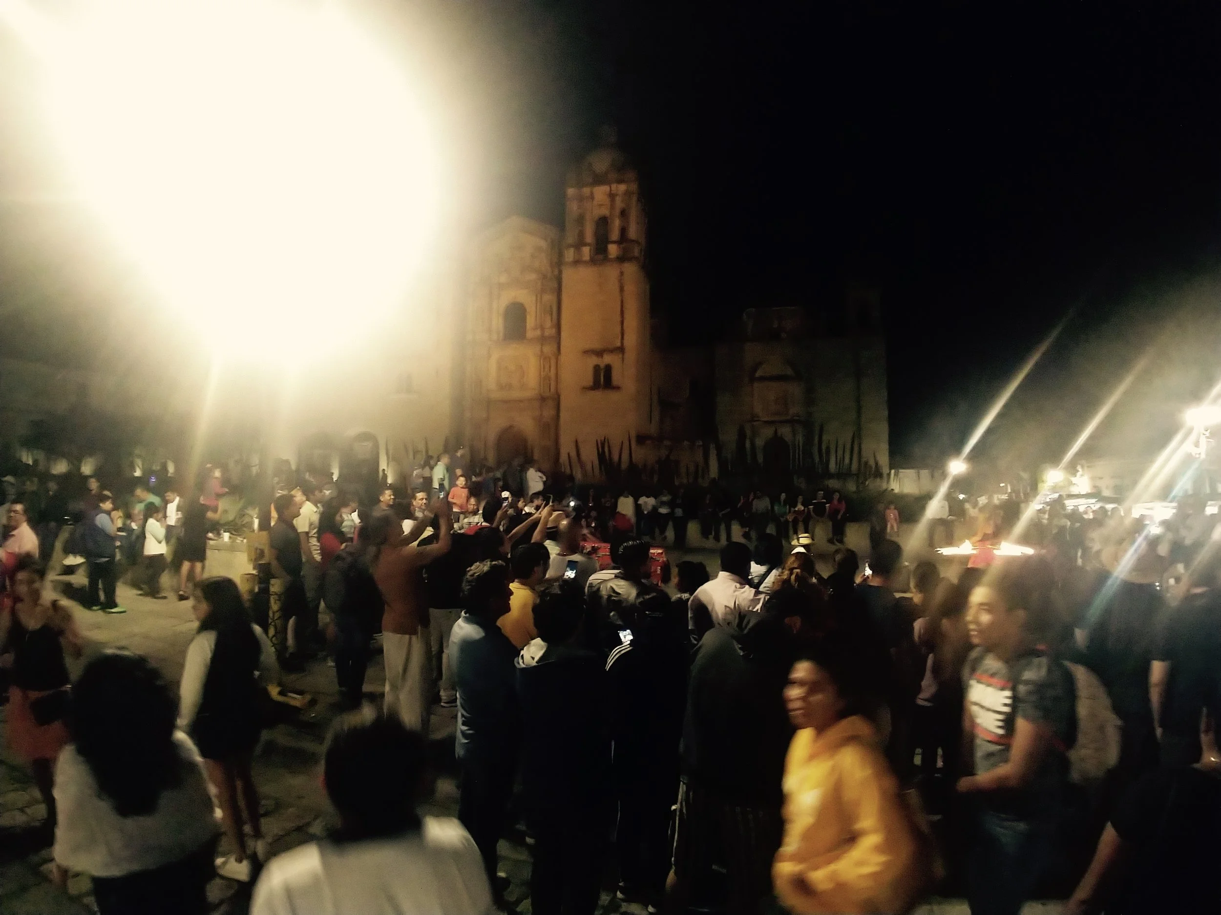 A square at night, filled with good looking people - Oaxaca, MX