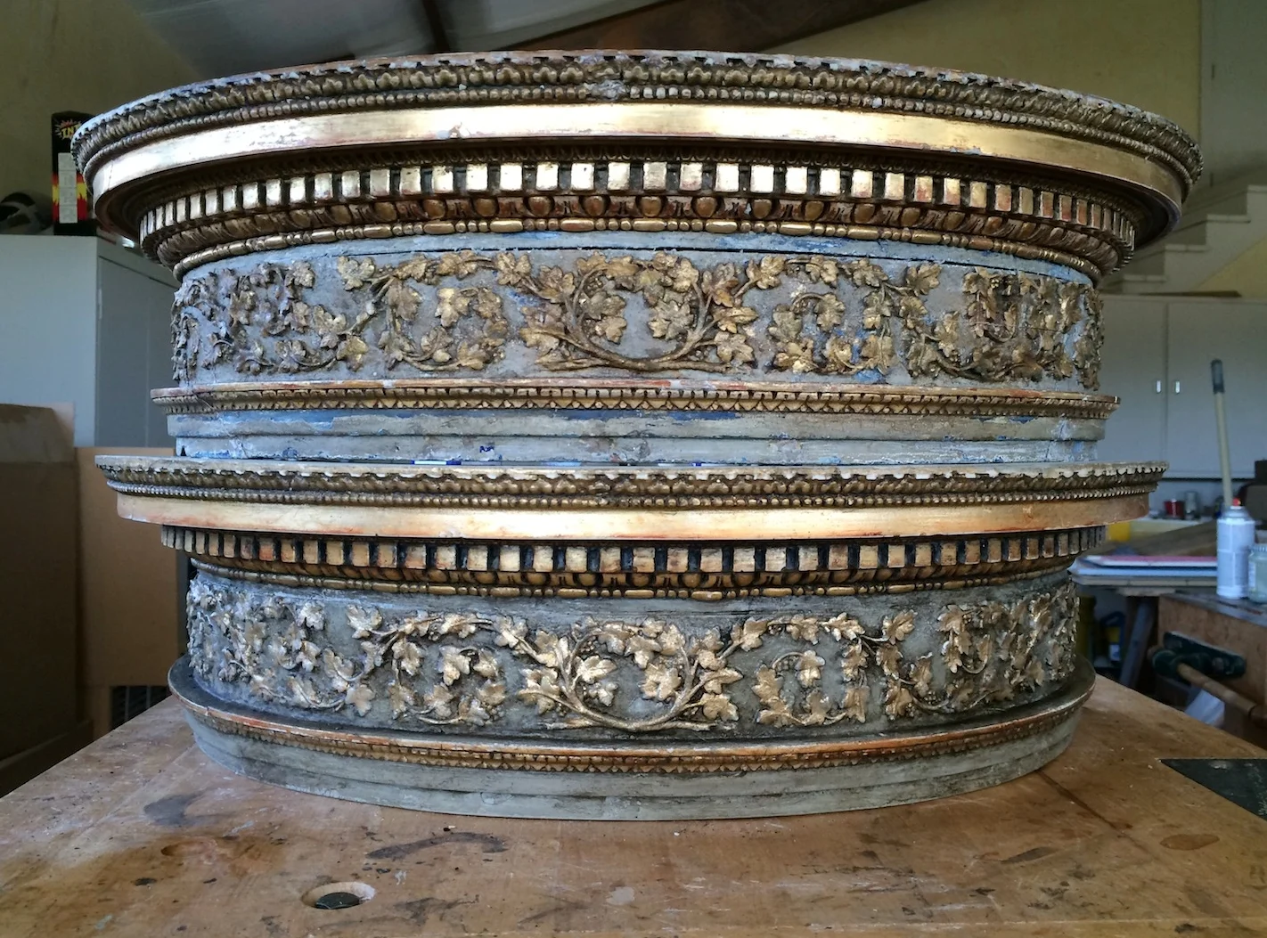 One of these console table aprons is an antique and one is a cast resin copy. After making the mold and casting the parts, a convincing finish completes the effect. The one mold can be used to make as many as one hundred copies.