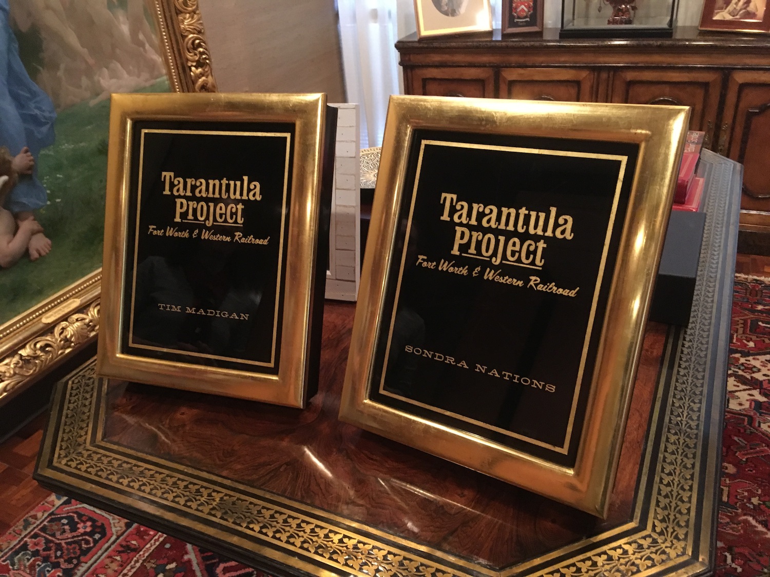   Here are book presentation and award boxes, of my design, featuring reverse painted and gilded glass faces surrounded by water gilt and burnished frames.&nbsp; The outer face of the box lifts off to reveal a book display easel.&nbsp; The interior i