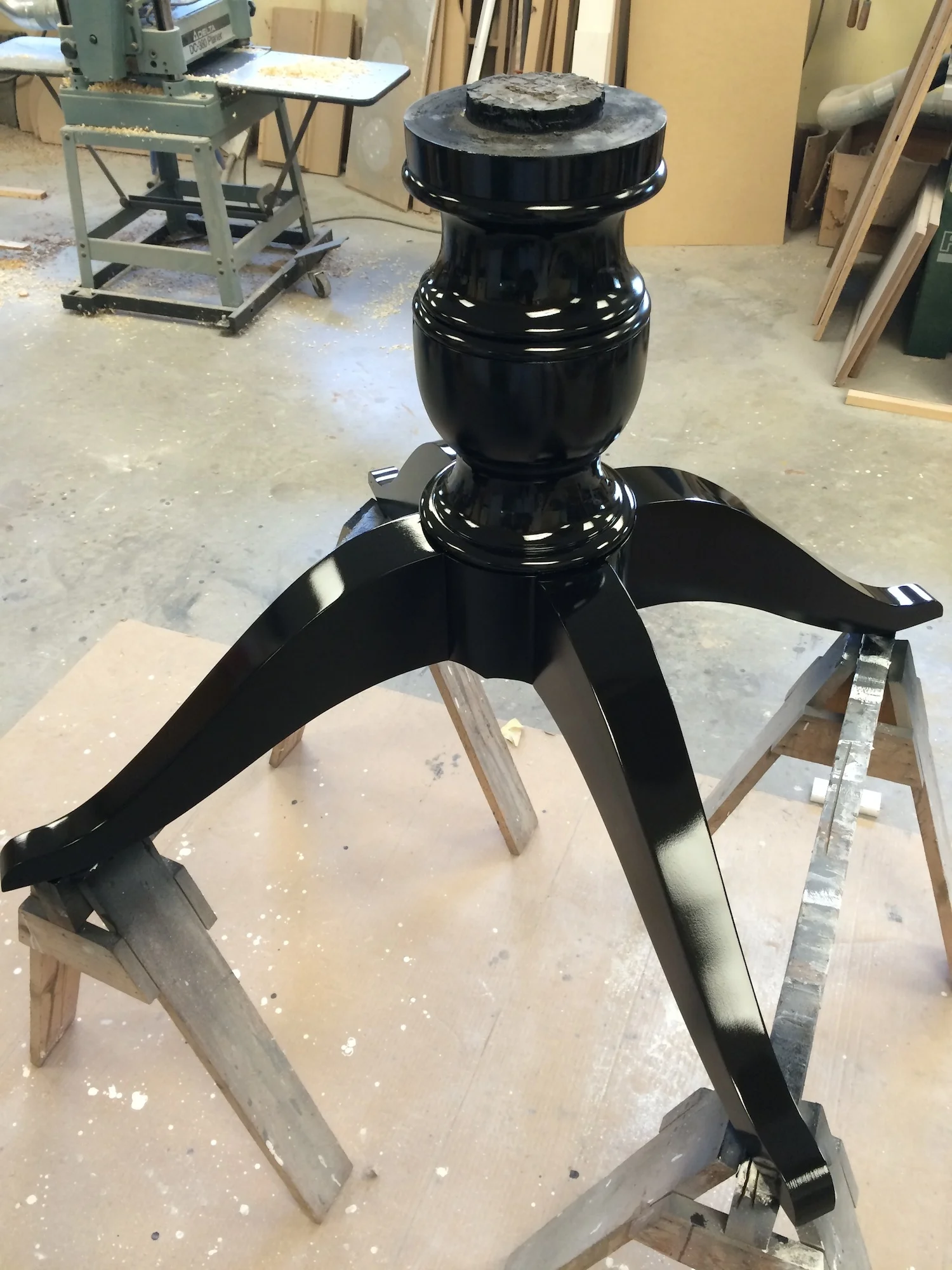Turned table base in maple with a black lacquer finish. Not shown is the base's sub-top.