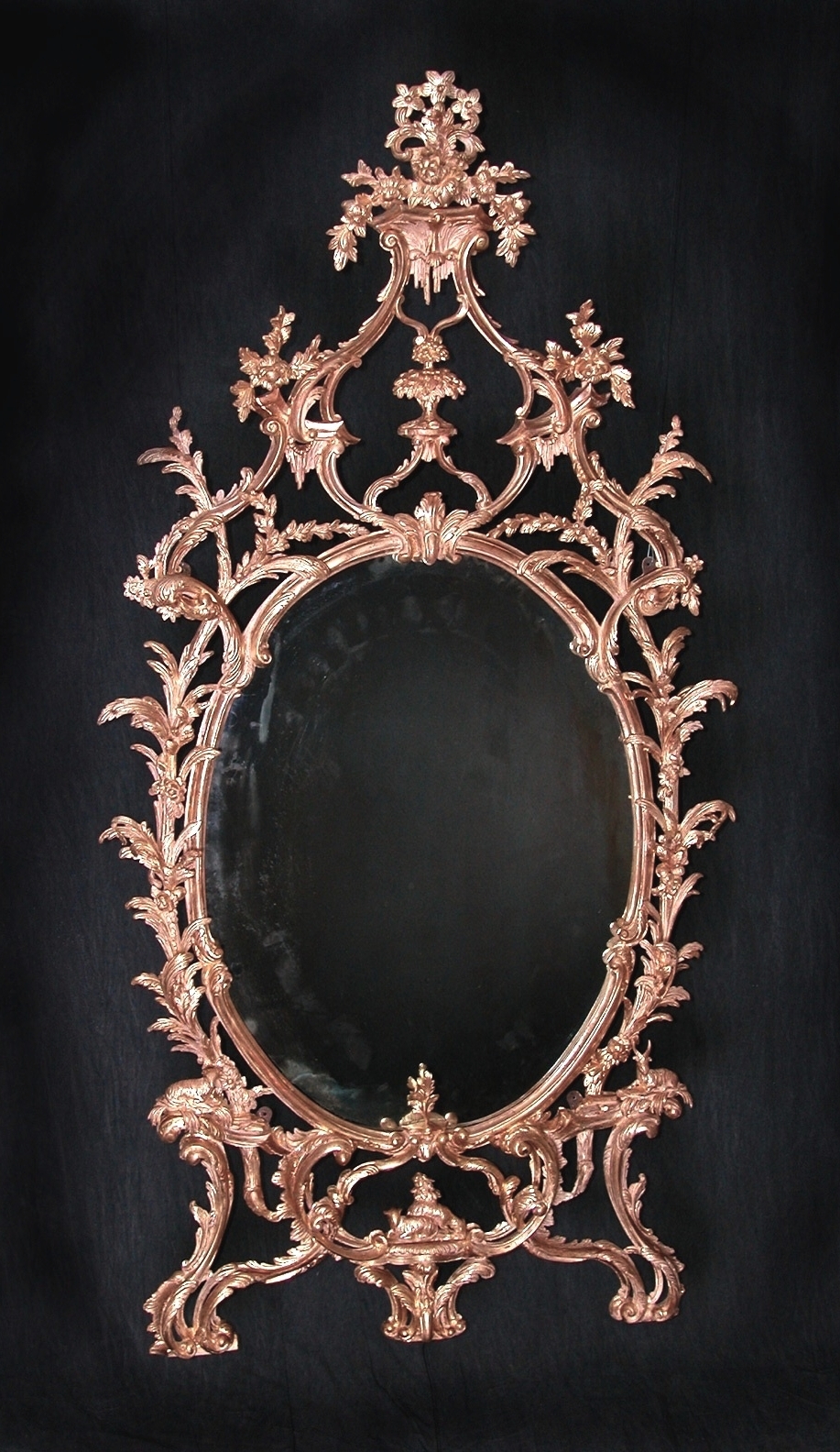   This is a copy of a 1765 Thomas Chippendale mirror created by using the original piece for the patterns as well as all other details - the color of the bole, the gold, and the nature of the distressing.&nbsp; It measures about&nbsp; 42" wide and 78