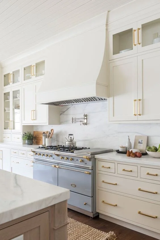 We almost did a stucco range hood to match our fireplace but decided we’d stick with wood. I like when the oven area is really wide and grand with stucco hood so our current space would be a bit tight.