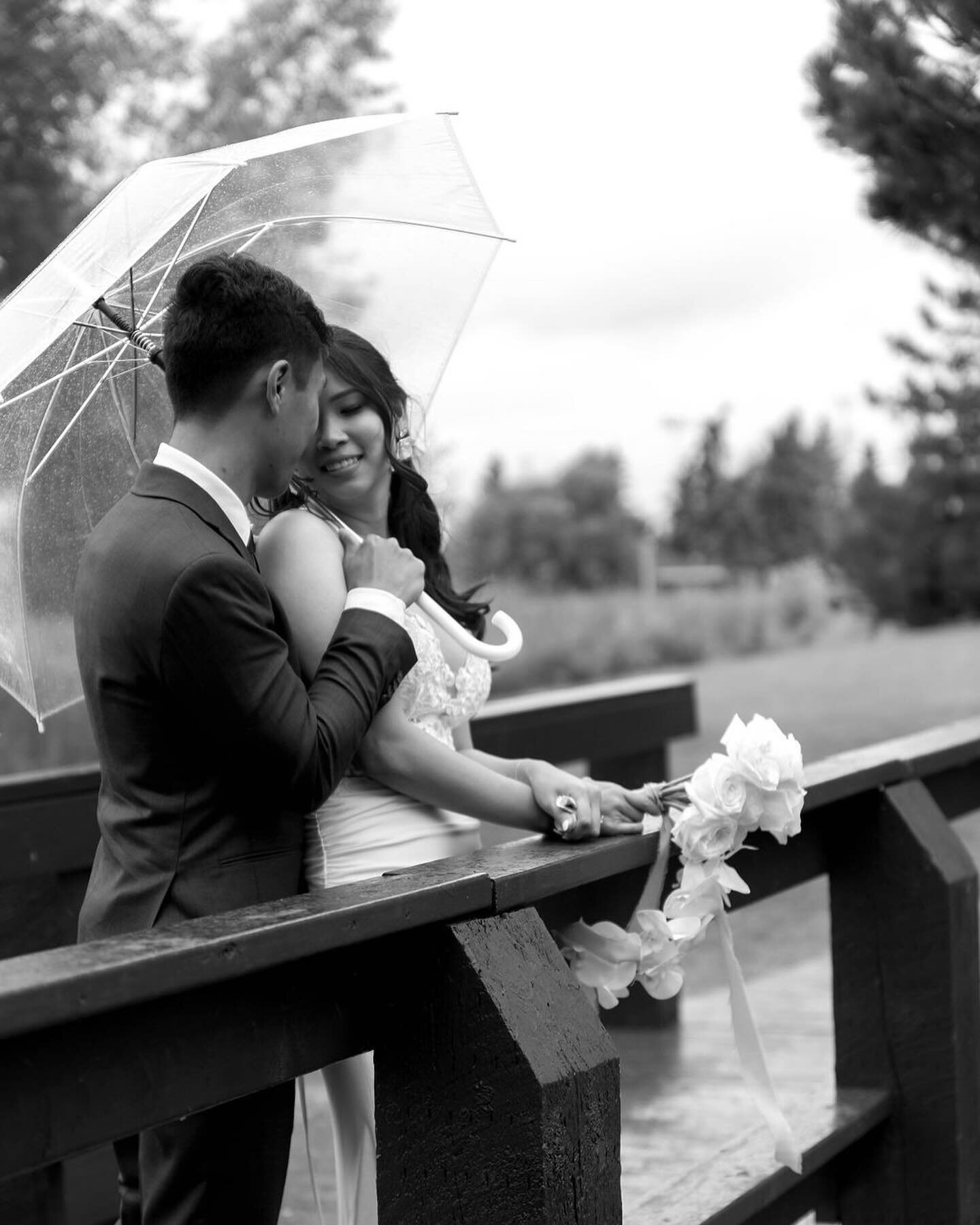 .
.
A little rain could not dampen the love J&amp;K shared. Underneath the clear umbrellas, love sparkled like raindrops, adding an extra touch of romance to every portrait captured. With all the beautiful florals grown by father of the bride, every 
