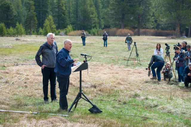 Gov. Jerry Brown addresses the media at a snowless snow survey site just south of Lake Tahoe on April 1, 2015. Photo by Florence Low/DWR.