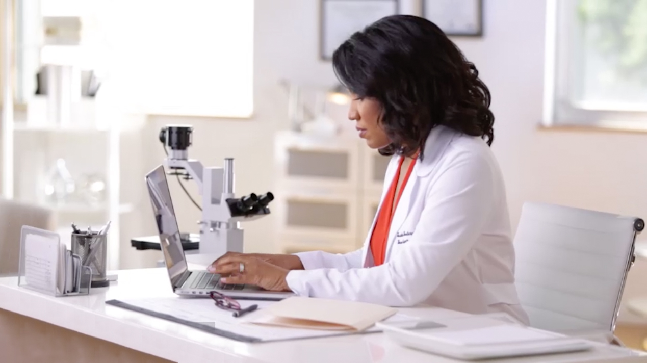 Dr. Heather Woolery Lloyd on computer.jpg