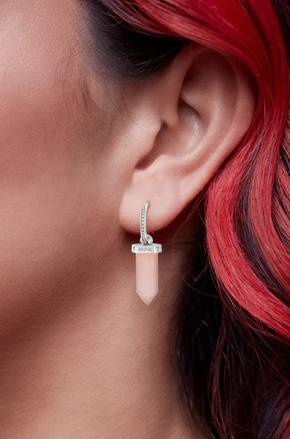 silver aroha earring on model.png