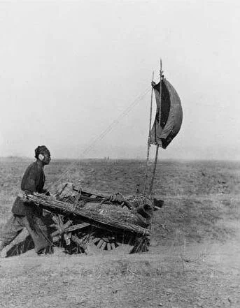 Dude with a wind powered land ship!