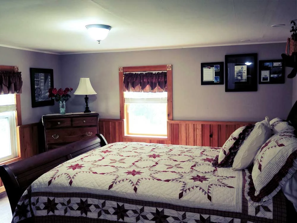 Comfortable queen bed and country theme