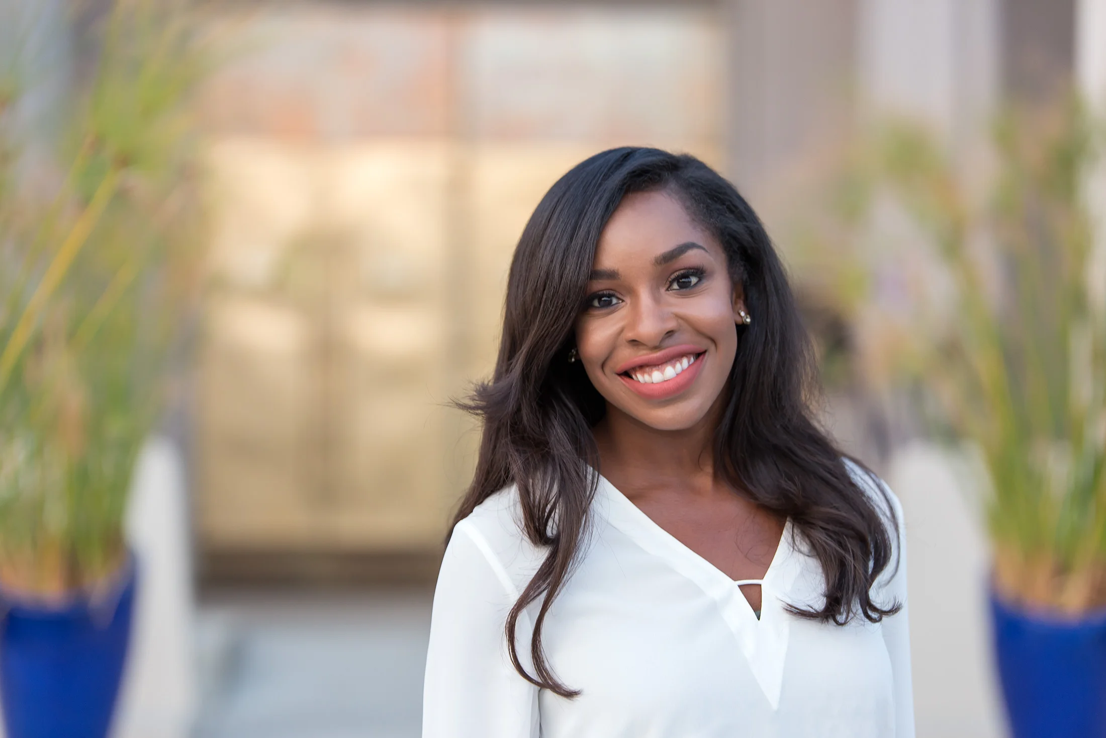 Corporate headshot taken in San Jose Bay Area, of Ashley, in front of the Egyptian Museum.