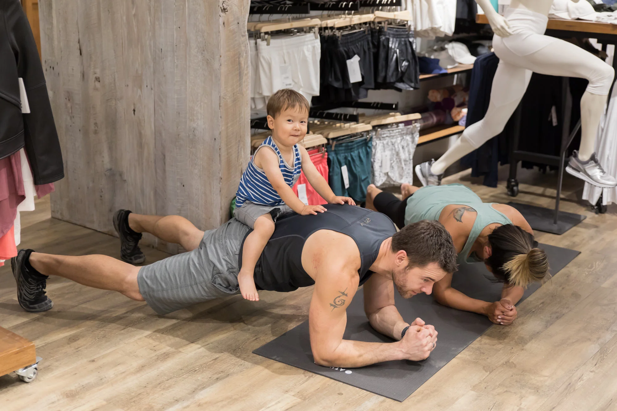 This little guy was a great sport, hanging out with his parents at the event while they worked out! I bet that plank is extra intense with the added weight! 