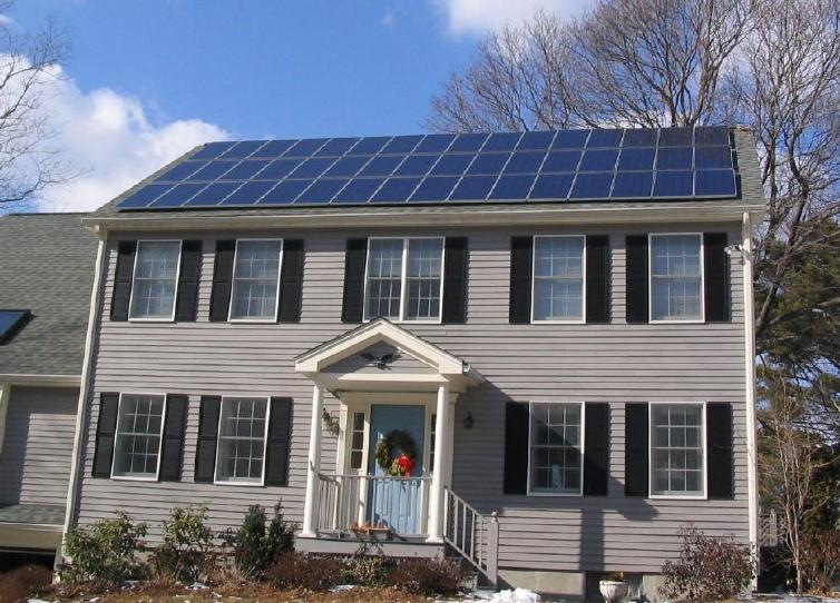 Solar_panels_on_house_roof_winter_view.jpg
