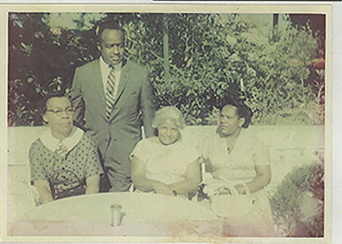 The only photo Avel Gorldy and Faye Marie Burch has with both grandmothers. Left-to-right: Grandmother Lessie Gordly, Uncle James Dowell; Mrs. Beatrice Gordly’s brother (eldest); Grandmother Alberta Louise Randolph (3rd marriage); and James’ wife Evelyn, Gordly-Burch Family Archive.