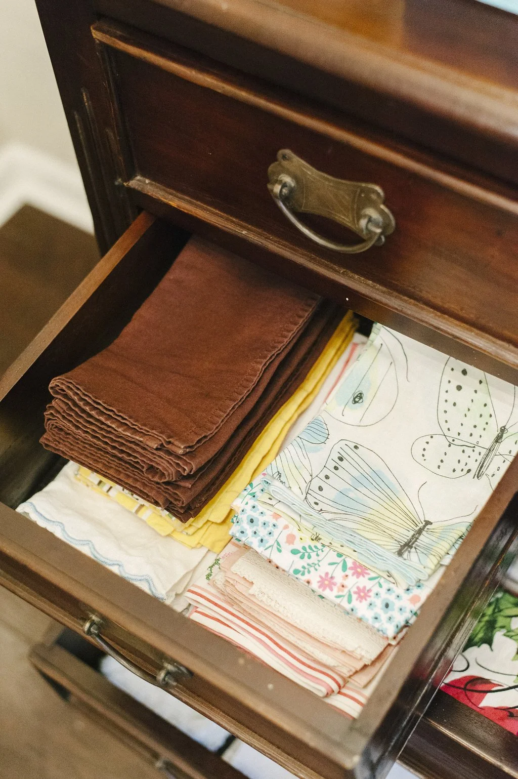 Organized Linens inside a cabinet drawer