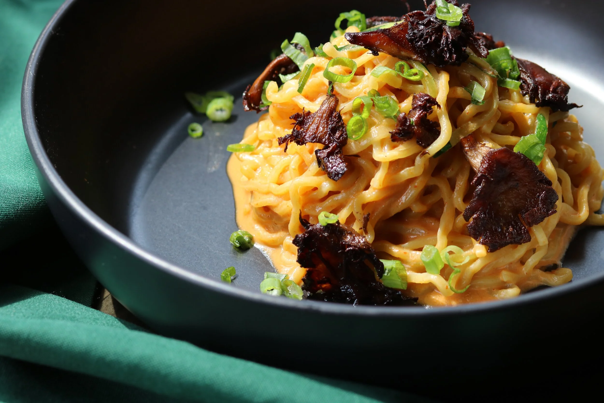 Dan Dan Noodles with spicy sesame sauce and 5 spice mushrooms.
