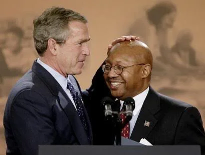 ABOVE, Black GOP Rolebots. Ben Carson and Alphonso Jackson, Bush’s pet negro in charge of HUD.