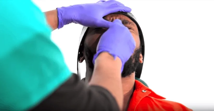 IN PHOTO Yasiin Bey (aka the mighty Mos Def) volunteered to undergo the standard operating procedures for force-feeding TO illustrate HOW FOUL THE PROCEDURE WAS WHEN IT WAS USED on detainees at guantanamo Bay detention facility. MOS DEF WONT BE PERFORMING AT THE SUPER BOWL THIS YEAR.