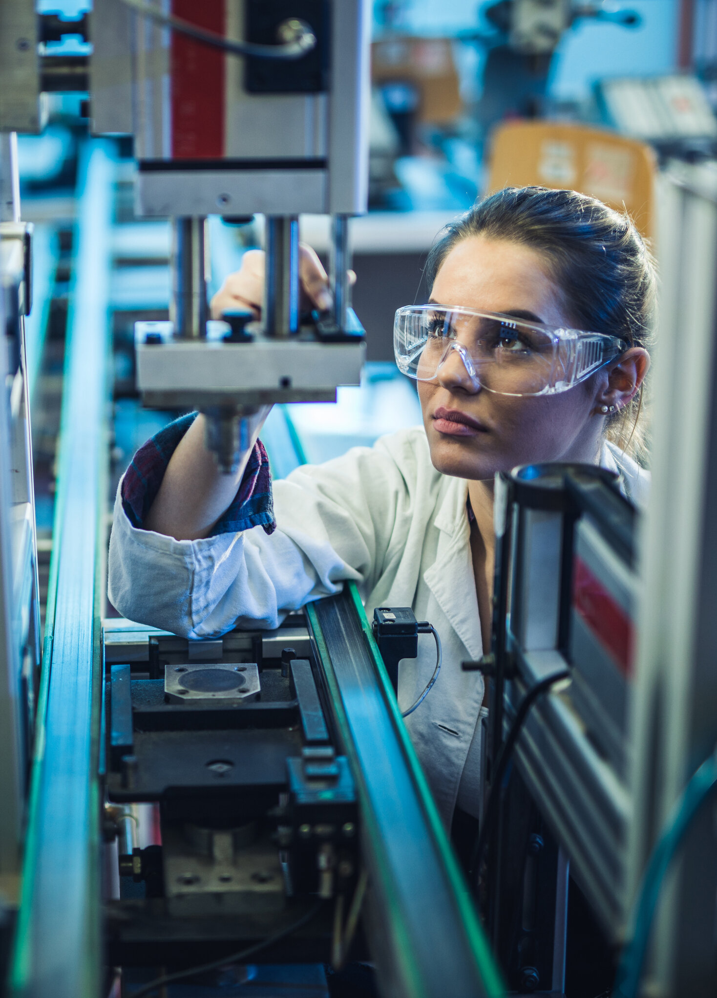 Female-engineer-examining-machine-part-on-a-production-line.-1164681581_1470x2045.jpeg