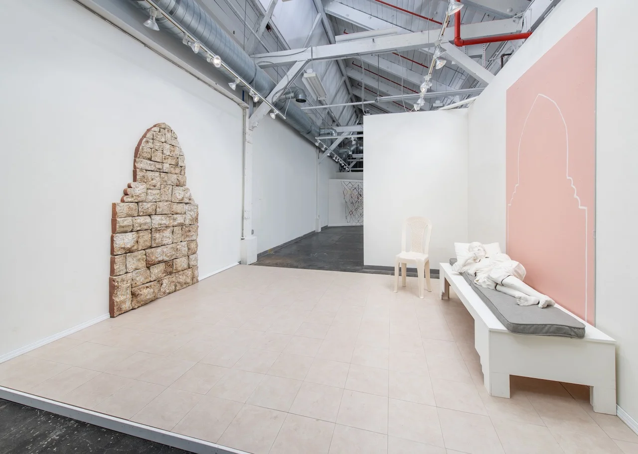 Wayn Ahla : Where Better ceramic, mixed media 2018 installation: 12’ x 15’ x 9’ ceramic rock wall: 55in x 8ft ceramic chair: 45in x 17in x 18in bench w/ ceramic figure: 79in x 30in x 20in