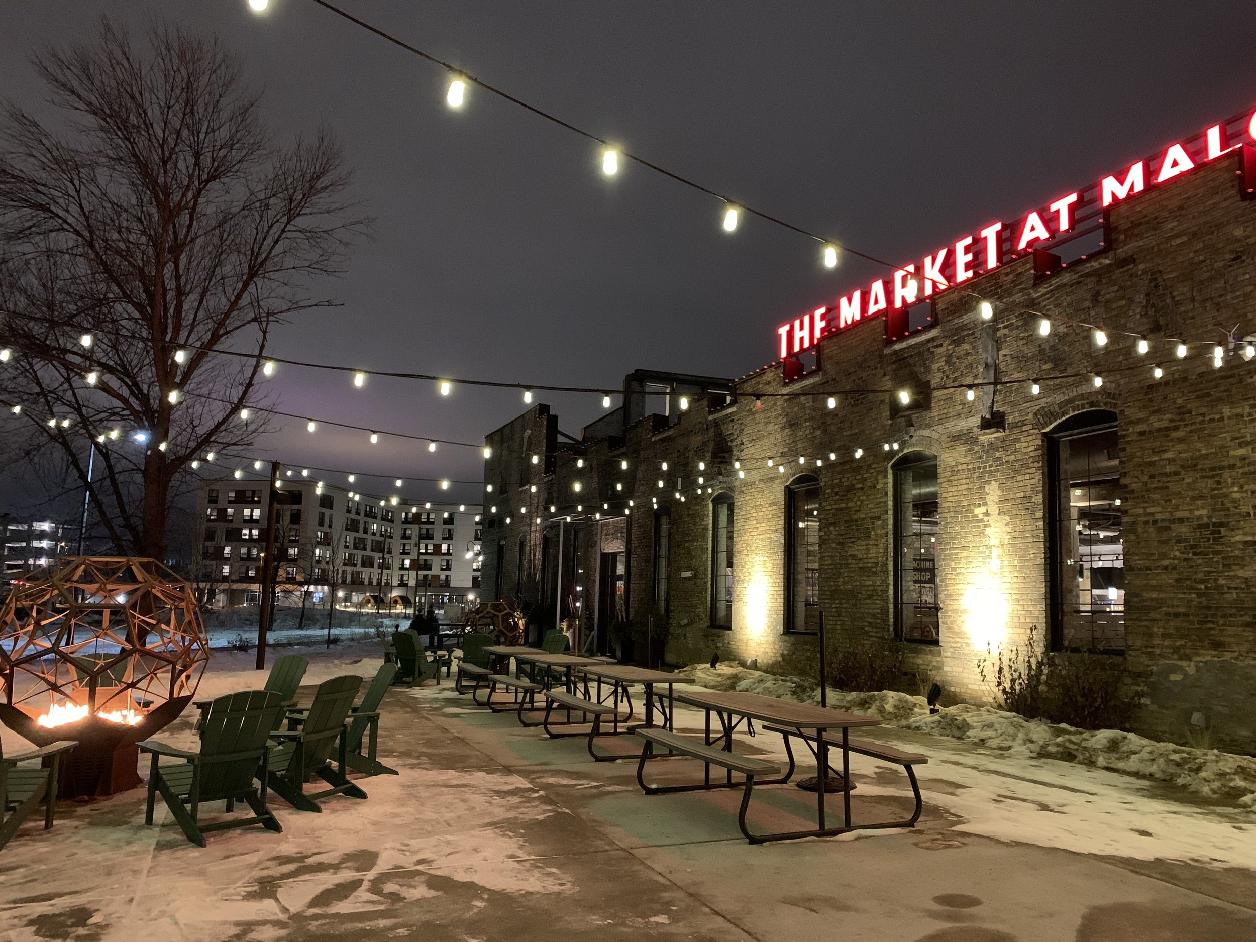 Outdoor patio with lights at night.jpeg