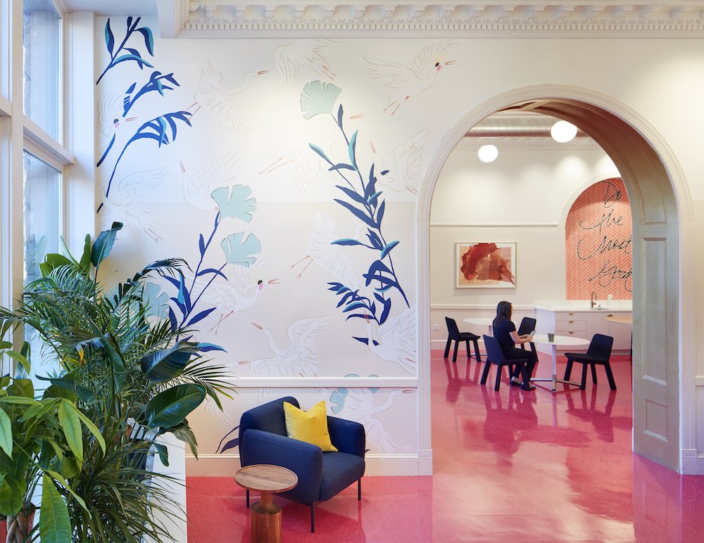 pink floor, archway, murals and plants.jpeg