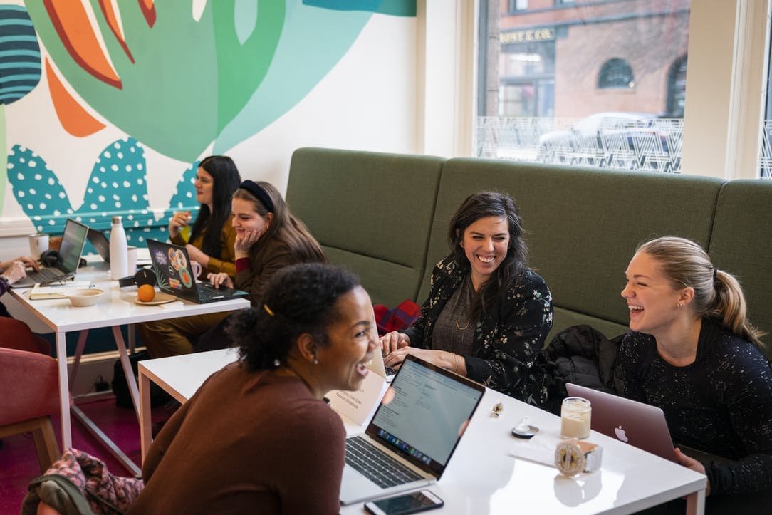 women working by window, laughing (by star tribune).jpeg