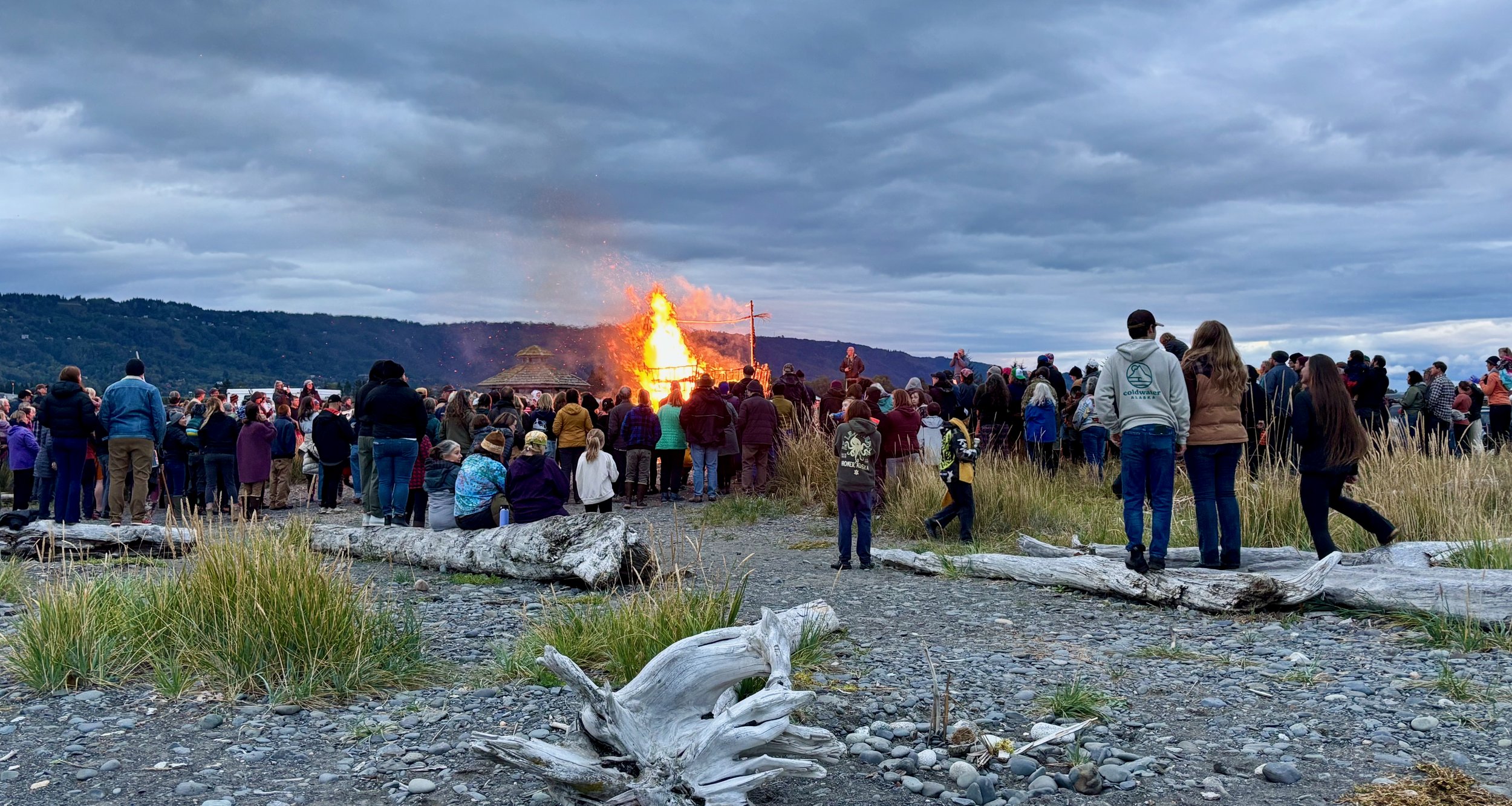 basket on fire with beach driftwood.jpeg