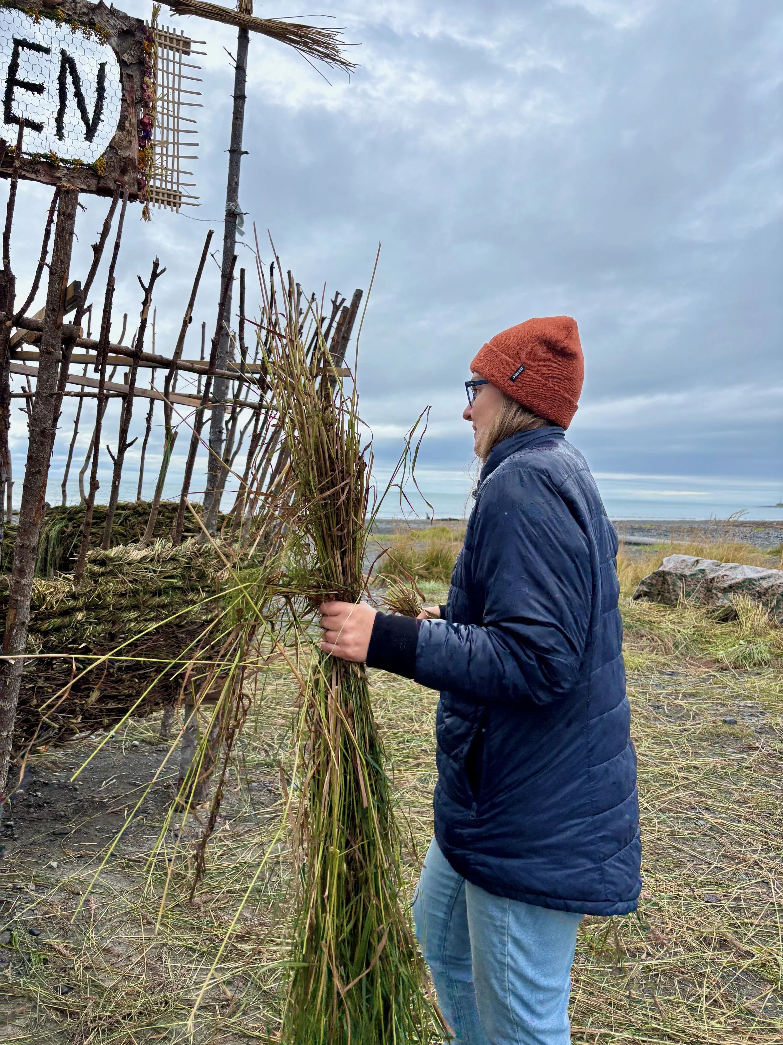 Volunteer weaving grass 2.jpeg