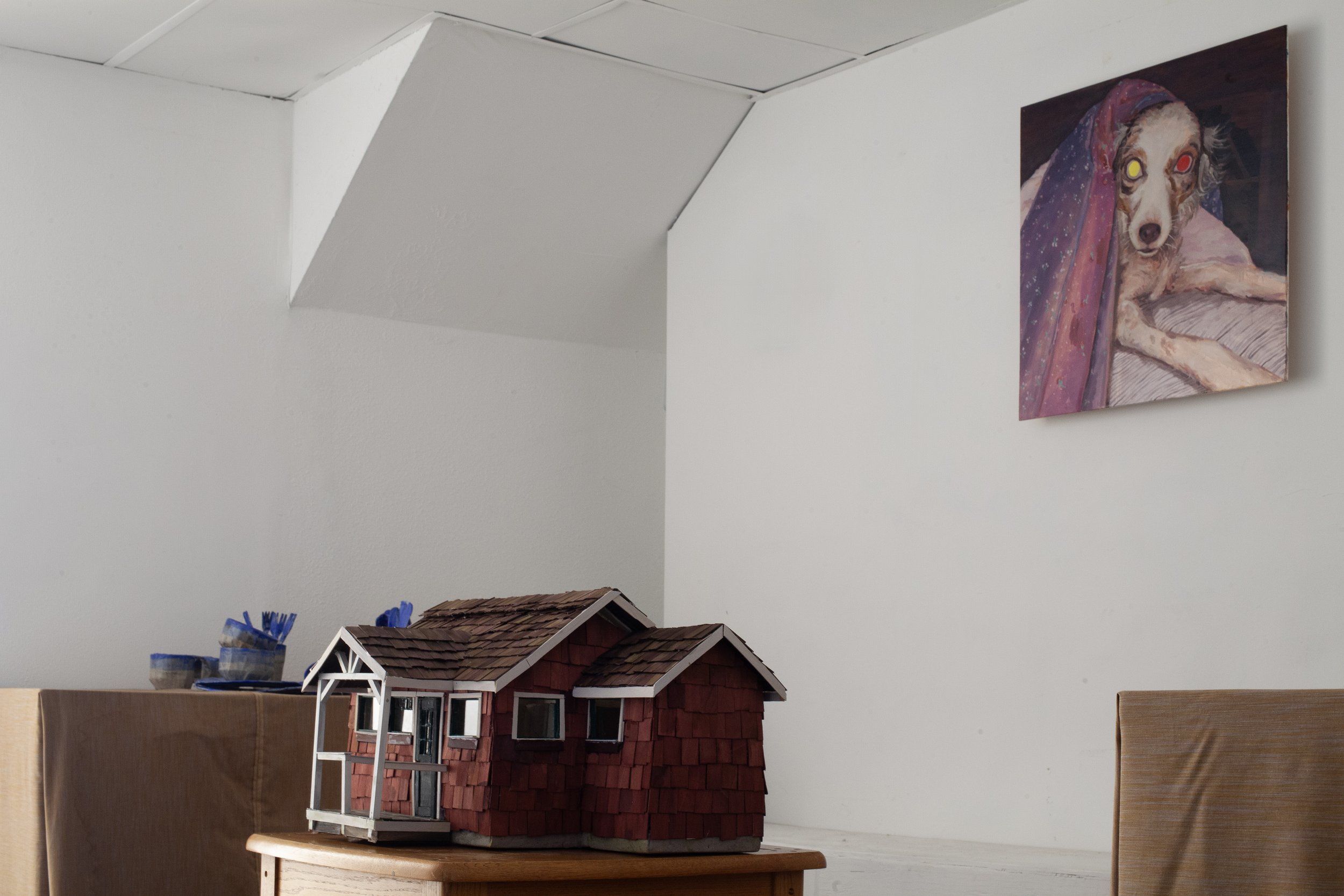   The Long Walk Home  exhibition view   Everyone Is There, Everyone Will Leave at Exactly The Same Time , 2025, cardboard, papier-mâché, wood, dye, acrylic paint, glass, wire, lemongrass, coffee, cloves, audio loop featuring loved ones (living and de