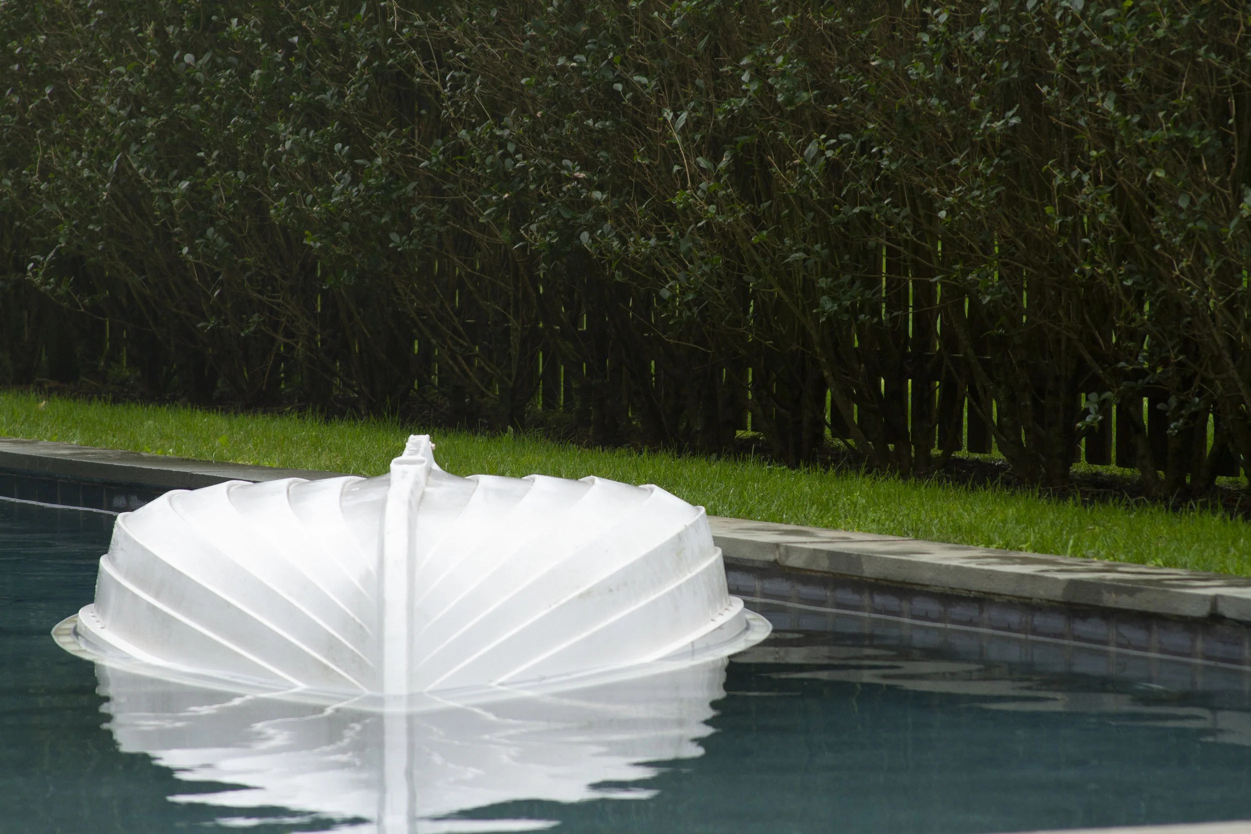    Water 12 Ways   Site-specific sculpture at  Hesse Flatow East , Amagansett, NY  Participants were invited to swim underwater to an upside down boat. Inside they were presented with a limited air supply and 100 vessels of water. 